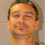Convicted felon held for gun possession, threatening officer